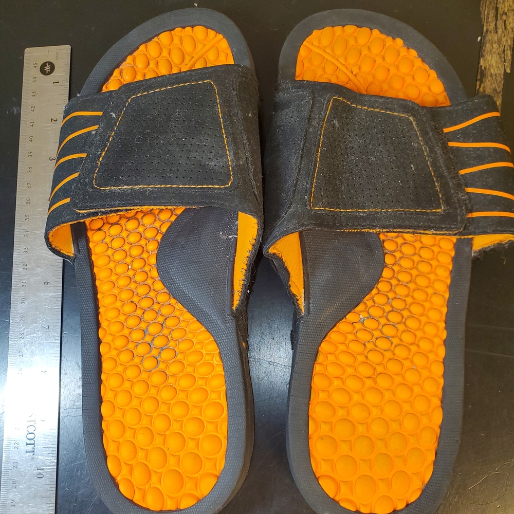 Slippers Size M (9 or 10).125" Long with adjustable top barely used 13oz